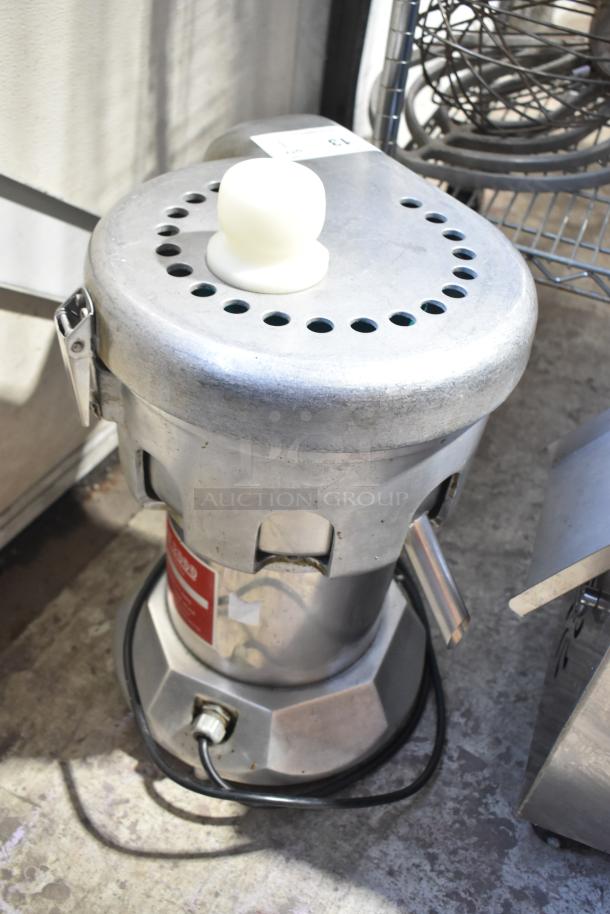 Ruby 2000 Commercial Juice Extractor, 115V, 1 Phase. Metal body, good condition, with power cord attached.