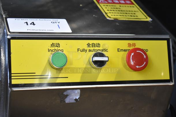 Commercial multifunction vegetable cutter with stainless steel body, featuring inching, fully automatic, and emergency stop controls on a yellow panel.