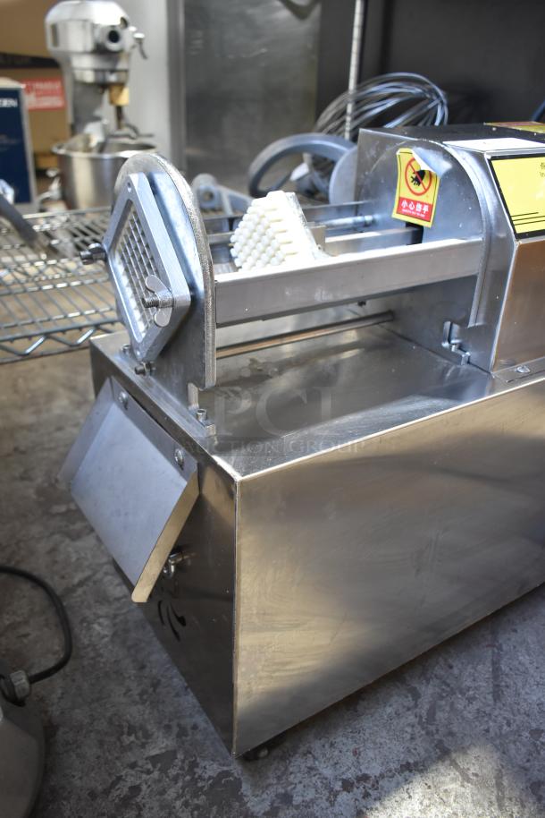 Commercial stainless steel electric vegetable cutter on casters, features multifunction blades, excellent condition.