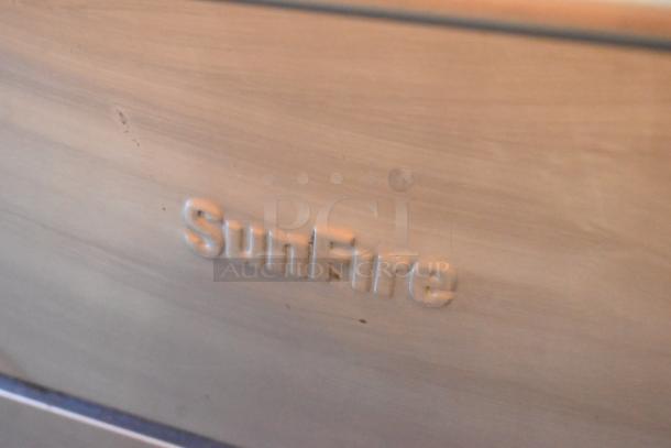 Garland X36-6R SunFire range close-up, showing the embossed "SunFire" logo on stainless steel surface.