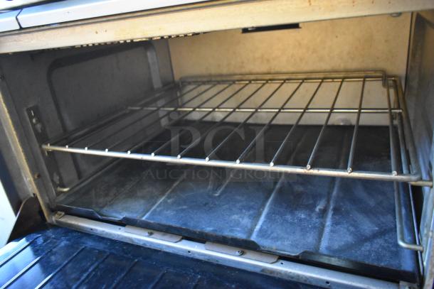 Garland X36-6R SunFire stainless steel commercial oven interior with dual racks and natural gas cooking capability.