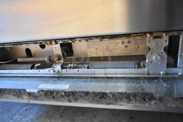 Garland X36-6R SunFire stainless steel 6 burner range with oven. Visible NSF label indicating commercial quality.