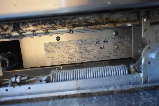 Garland X36-6R SunFire stainless steel commercial range label; shows model, gas specs, and NSF certification.