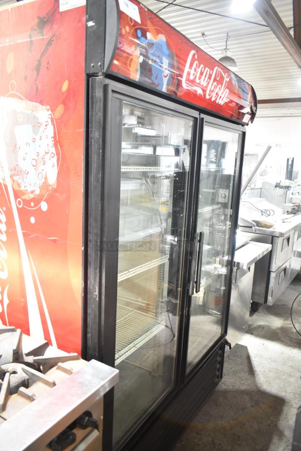 True GDM-49 Commercial 2 Door Cooler Merchandiser, Coca-Cola branding, 115V, used condition, glass doors, interior shelves.
