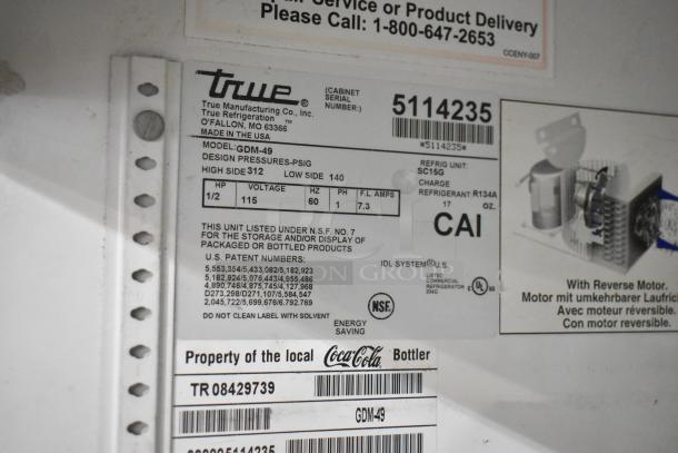 True GDM-49 commercial cooler label showing model, voltage, and refrigerant details; NSF certified, 115V, 1 phase.