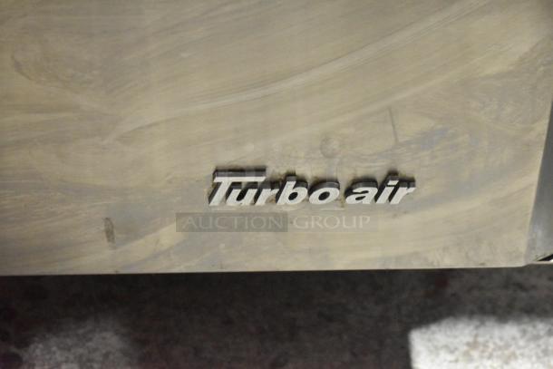 Turbo Air MST-28-12-N logo on stainless steel surface of commercial salad prep table.