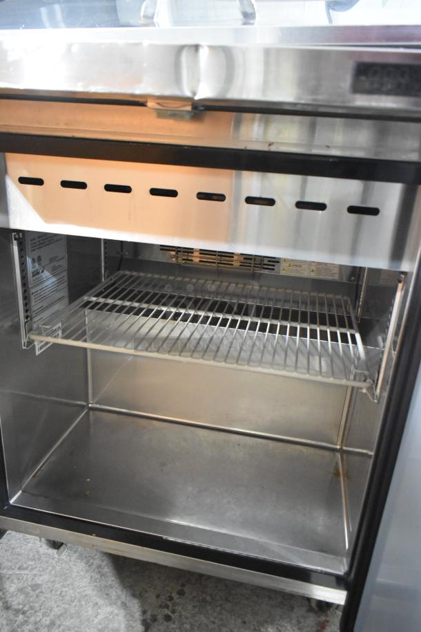 Turbo Air MST-28-12-N commercial sandwich prep table with open stainless steel interior, wire shelf, and visible vents.
