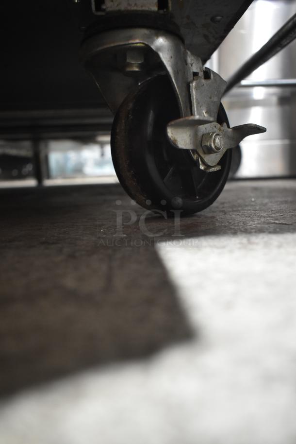 Turbo Air MST-28-12-N prep table commercial caster, showing durable wheel and locking mechanism for easy mobility.