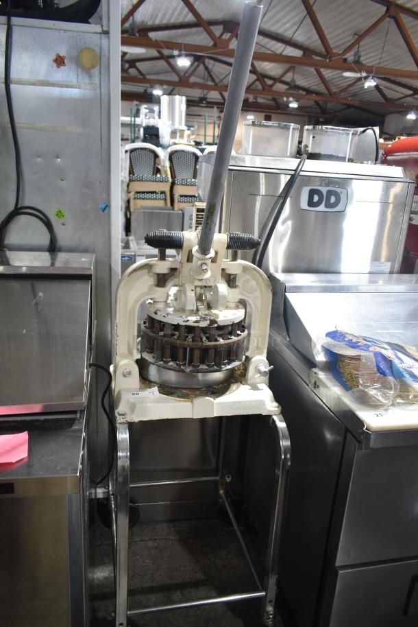 Dutchess BM58 manual dough divider on casters, floor style, good condition, visible lever mechanism, commercial kitchen setting.