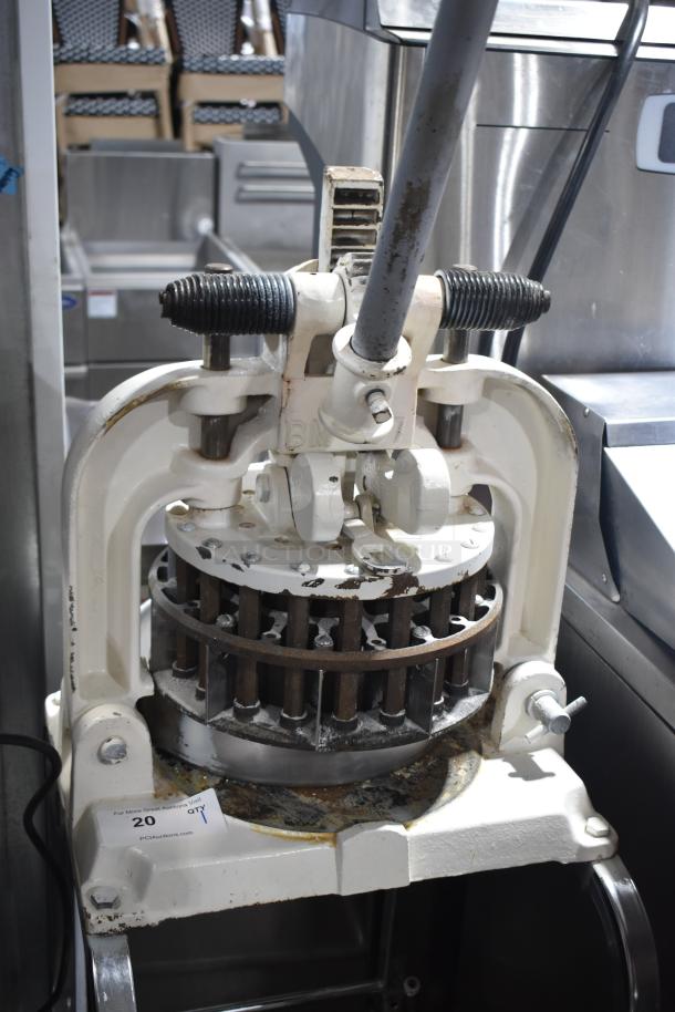 Dutchess BM58 manual dough divider on commercial casters, used condition, visible wear on metal parts, ideal for bakery use.