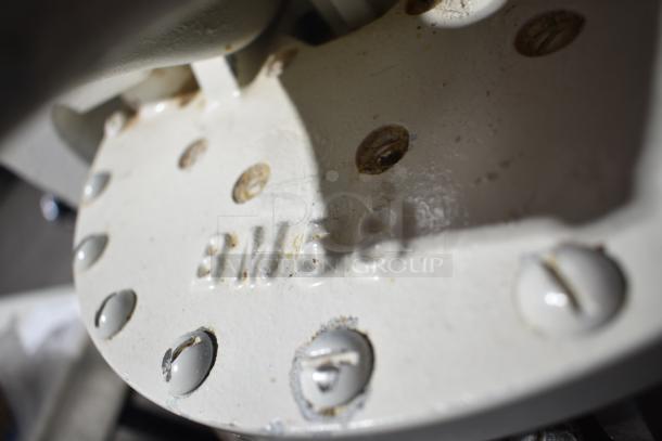 Dutchess BM58 commercial dough divider, visible model marking, signs of wear, includes commercial casters.