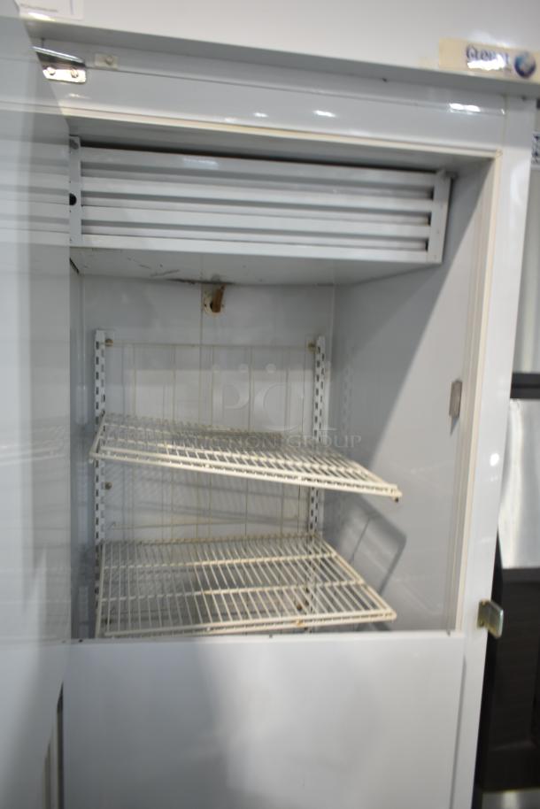 Global T30HSP single door hardening cabinet, commercial grade, 115 volts, 1 phase, visible shelving, clean condition.