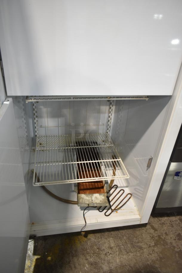 Global T30HSP single door hardening cabinet, commercial use, 115V, 1-phase, visible shelving, minor wear, sturdy construction.