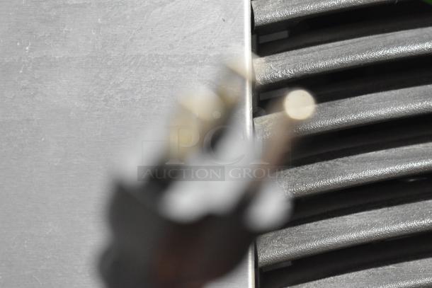 Manitowoc ID0322A-161 commercial ice head on hotel dispenser, 115V, 1 Phase, visible vent grilles, blurred focus.