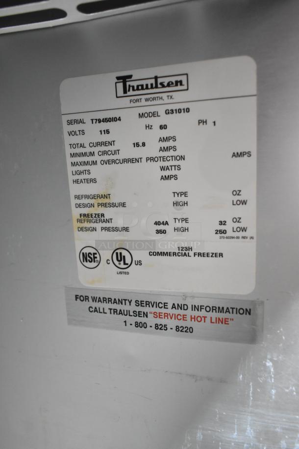 Traulsen G31010 Commercial 3 Door Freezer label showing model, specs, 115V, 1 phase, UL and NSF certifications, service info.