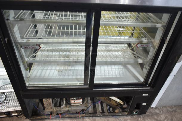 True TCGR-50 Commercial Refrigerated Display Case, 115 Volts, 1 Phase, showing sliding glass doors and wire shelving.