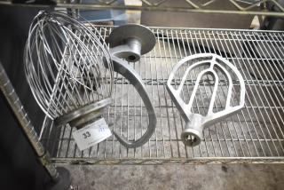 3 Hobart mixer attachments: whisk, paddle, and dough hook. Metal, lightly used, with visible auction tag reading "33, Qty x3."