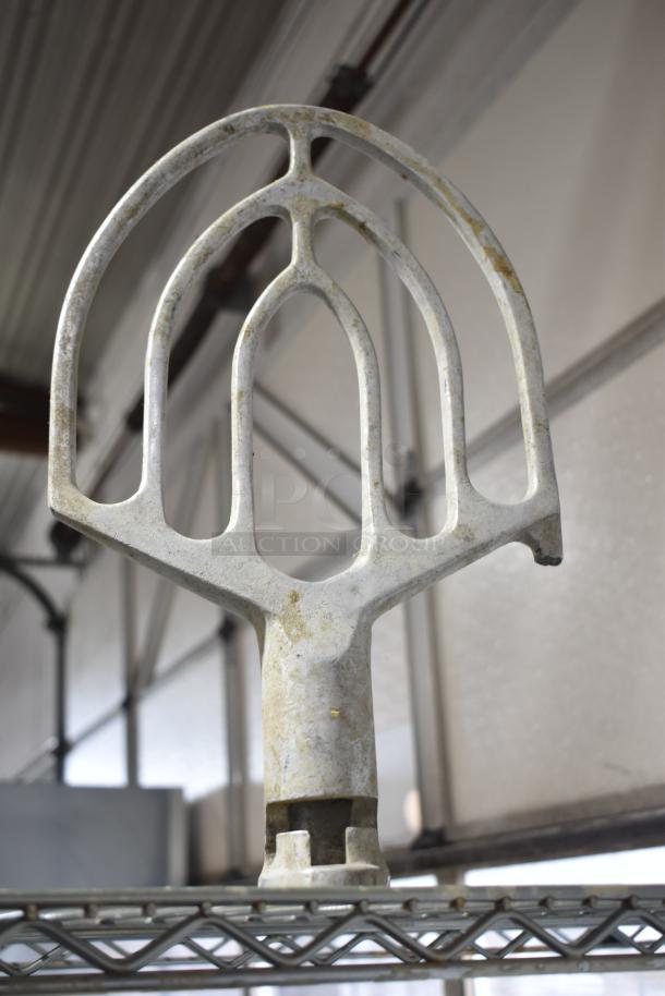 Hobart mixer attachment, 30-quart paddle, metal construction, used condition, visible wear, for commercial mixer.