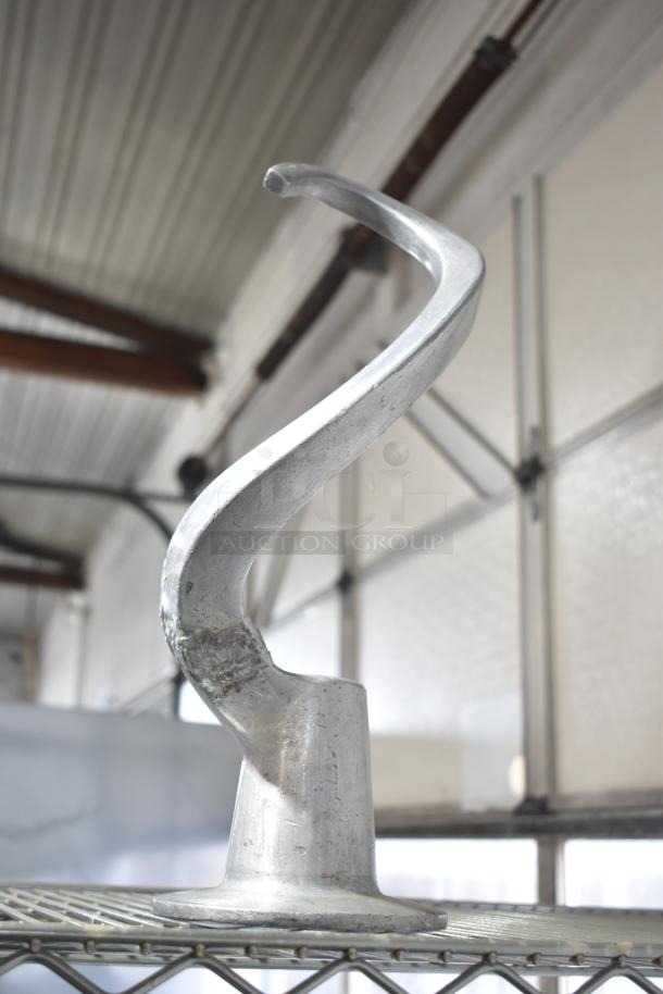 Metal dough hook attachment for Hobart mixer; sturdy, used condition, compatible with 30-quart models.