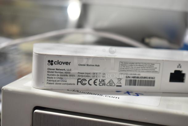 Clover POS System hub, Model H500, label showing power input details and manufacturer info.