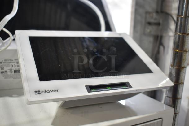 Clover POS System with S505 display, C505 terminal, visible marks, in fair condition.