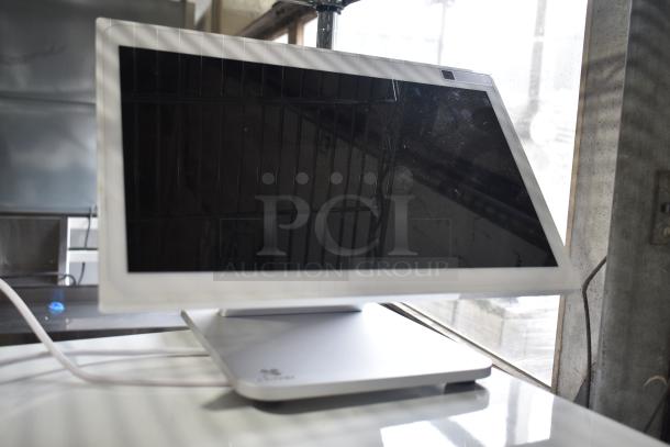Clover S505 POS display with sleek design, silver base, and power cord. Clean screen and minor wear visible.
