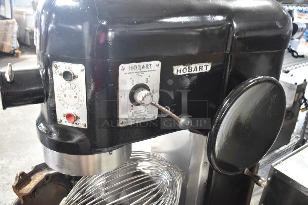 Hobart L800 commercial 80 quart dough mixer with bowl, adapter, paddle, whisk, and dough hook. 220V, 3-phase.
