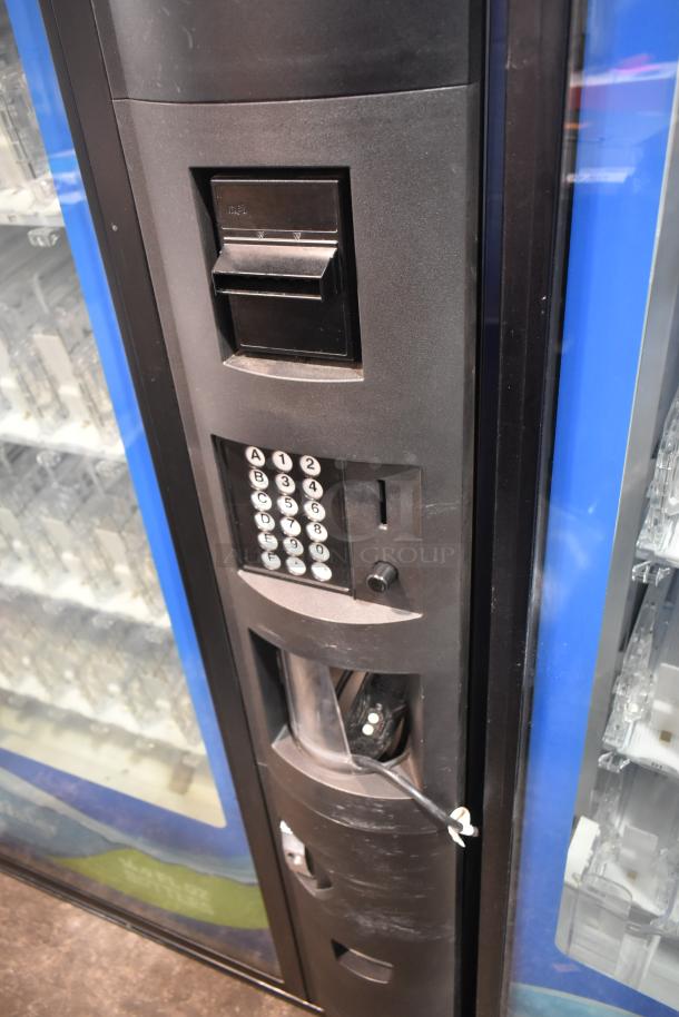 Crane 5800-4 commercial drink vending machine with bill acceptor. Black metal exterior, keypad, and coin slot visible.