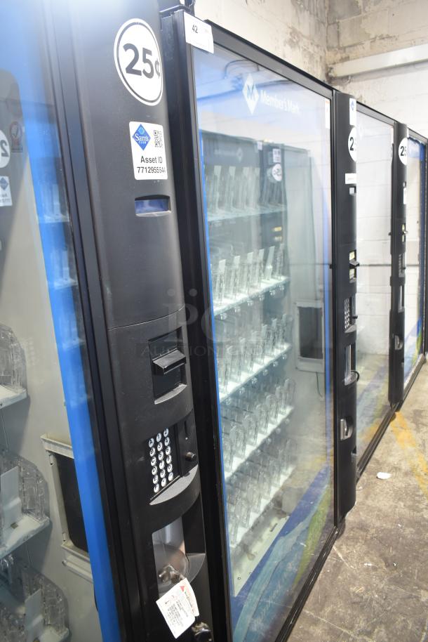 Crane 5800-4 metal commercial bottled drink vending machine with bill acceptor, 115 volts, 1 phase, in used condition.