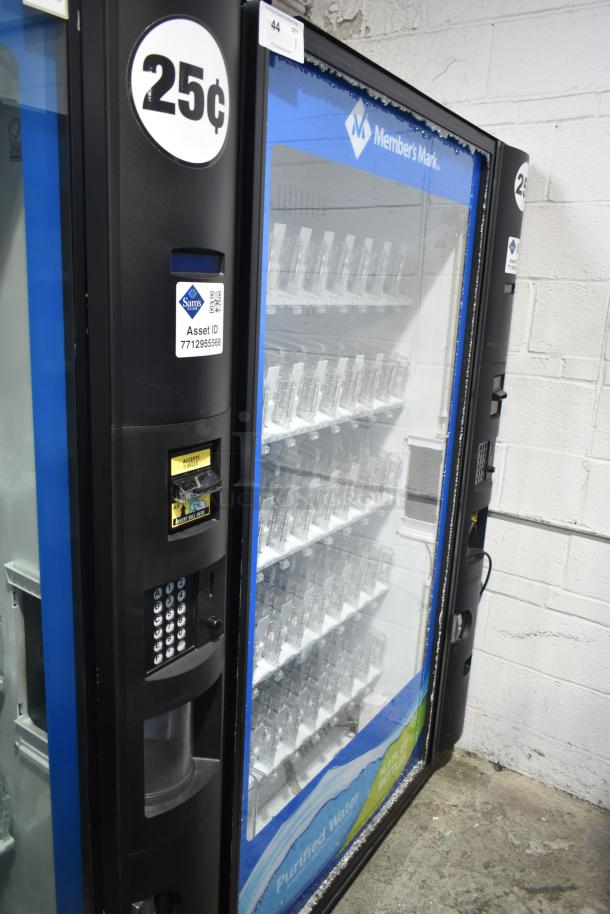 Crane 5800-4 vending machine with bill acceptor, priced at 25 cents. Note visible glass damage. Model features commercial beverage slots and operates on 115 volts, 1 phase.