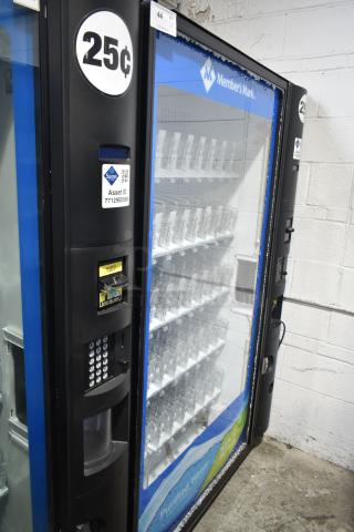 Crane 5800-4 vending machine with bill acceptor, priced at 25 cents. Note visible glass damage. Model features commercial beverage slots and operates on 115 volts, 1 phase.