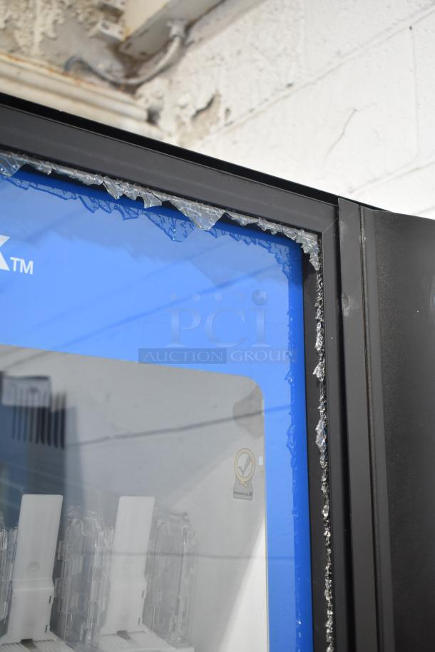Crane 5800-4 metal commercial drink vending machine with bill acceptor; visible glass damage on door; 115 volts, 1 phase.
