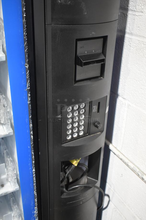Crane 5800-4 vending machine, metal construction, bill acceptor, glass damage visible, keypad controls, 115V, 1 Phase.