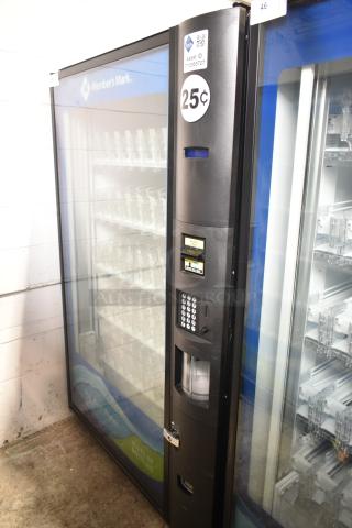 Crane 5800-4 metal commercial bottled drink vending machine with bill acceptor, 115 volts, in used condition.