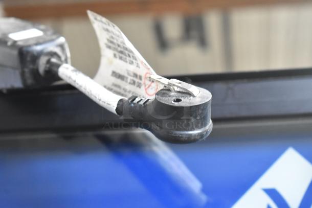 Crane 5800-4 vending machine; metal, commercial, with bill acceptor; visible power cord and tag showing electrical details.
