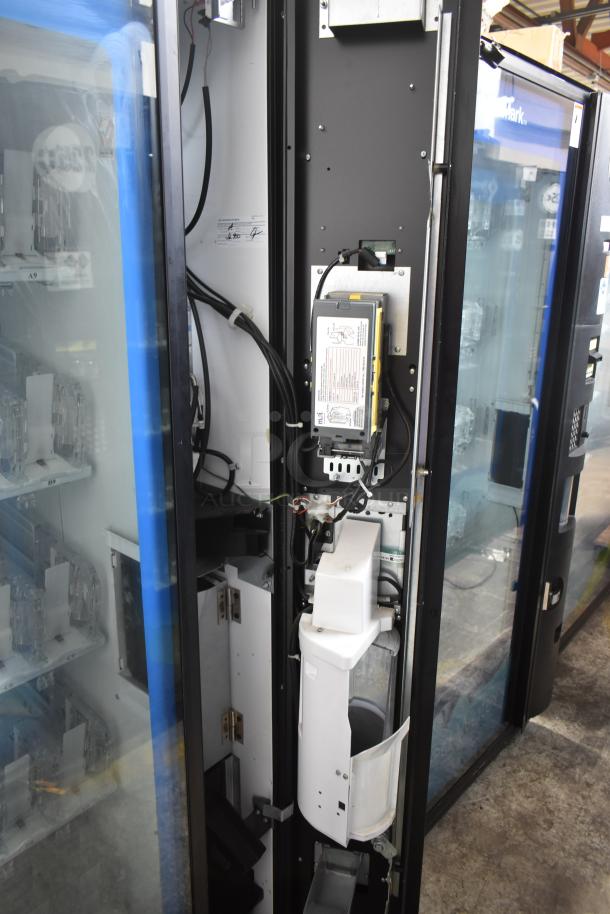 Crane 5800-4 metal vending machine with bill acceptor, 115V, 1 phase. Interior view showing machine components. Good condition.