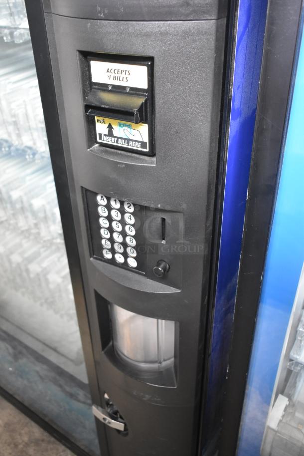 Crane 5800-4 metal vending machine with bill acceptor, keypad, 115V, 1 phase, in good condition.