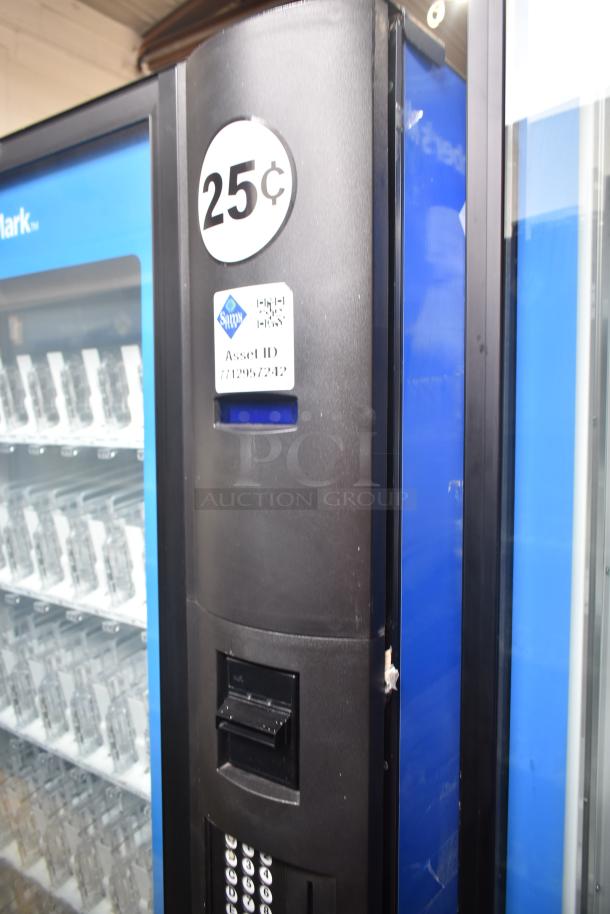 Crane 5800-4 commercial vending machine with bill acceptor. 115 volts, 1 phase, marked "25¢" and asset ID tag visible.