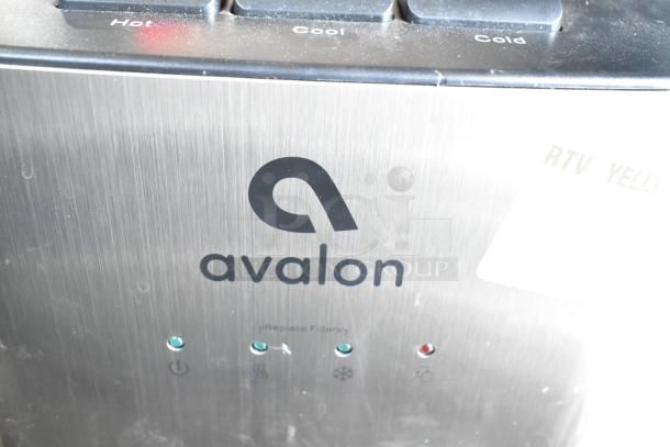 Avalon A23F Bottom Loading Water Cooler with hot, cool, and cold settings, stainless steel body. "Replace Filter" indicator.