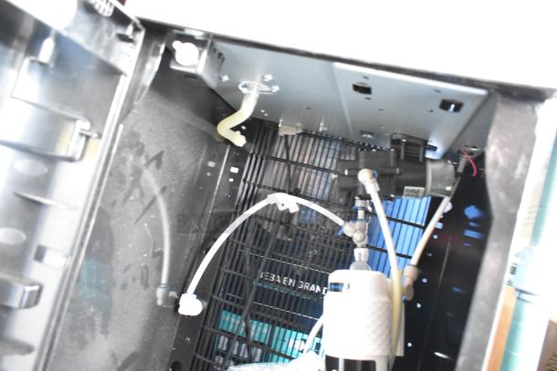 Interior view of Avalon A23F water cooler bottom compartment with tubing and components visible.