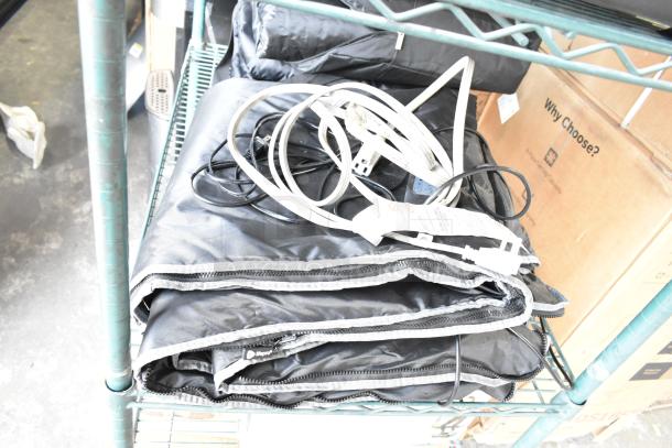 LifePro LP-BRMDYL-BLK-1 Sauna Blanket on shelf, 110V, includes electrical cords, black color, new condition, label visible.