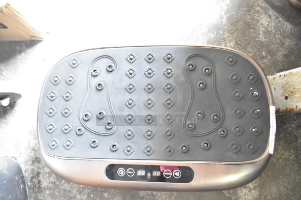 LifePro vibration plate with textured surface, control panel, and foot imprint design. Appears in good condition.
