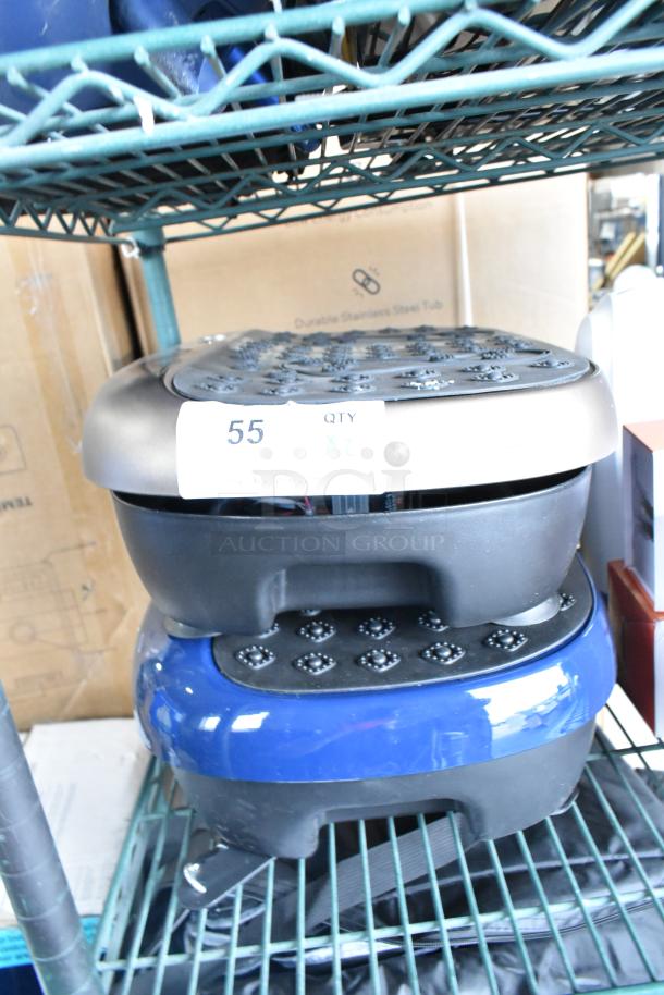 Two LifePro vibration plates on a metal shelf, stacked. Includes numbered label, indicating two times the bid.