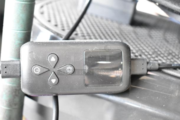 Remote control for LifePro vibrating plate, featuring power, control buttons, and display screen.