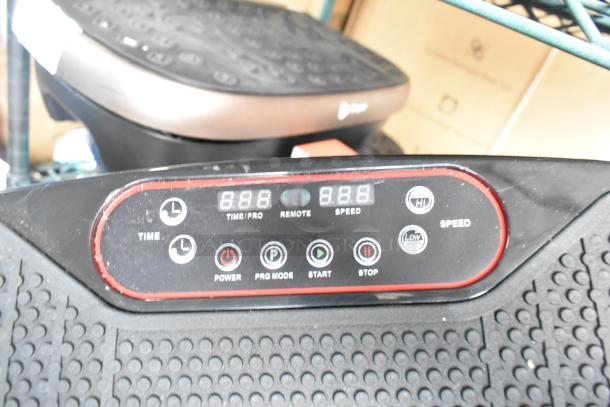 Two LifePro vibrating plates with textured surfaces and digital controls, including power, mode, and speed settings. Good condition.