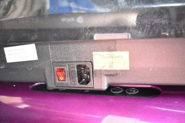 Power switch and plug area of a LifePro vibrating plate. Labels include a warning and contact info for LifePro support.