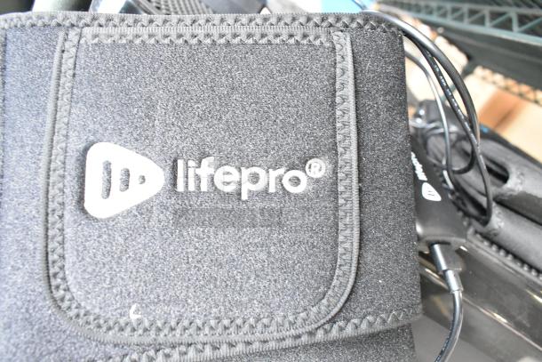 LifePro vibrating plate with visible logo and cables; part of a 4-item auction bundle.