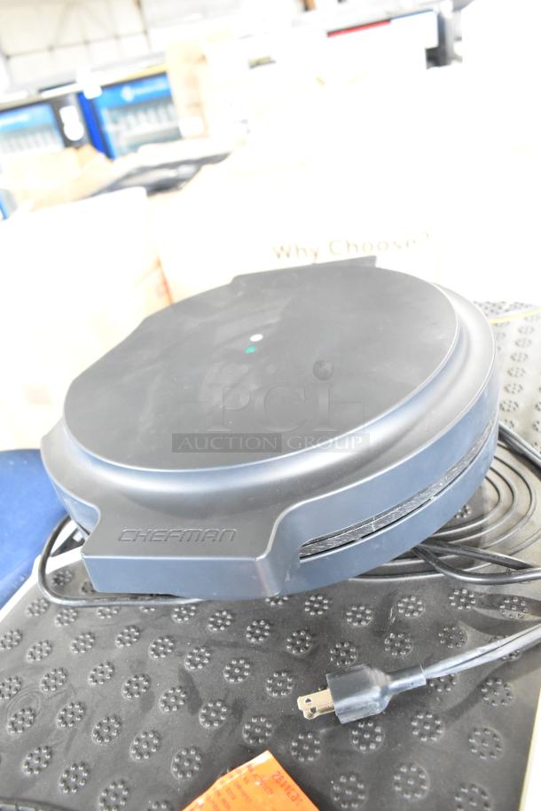 Chefman RJ58-EM-MIDNIGHT-AM-E Pizza Maker, black, with visible power cord, in good condition.