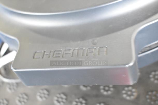 Chefman RJ58-EM-MIDNIGHT-AM-E pizza maker, visible logo, sleek design, part of a four-item auction set.