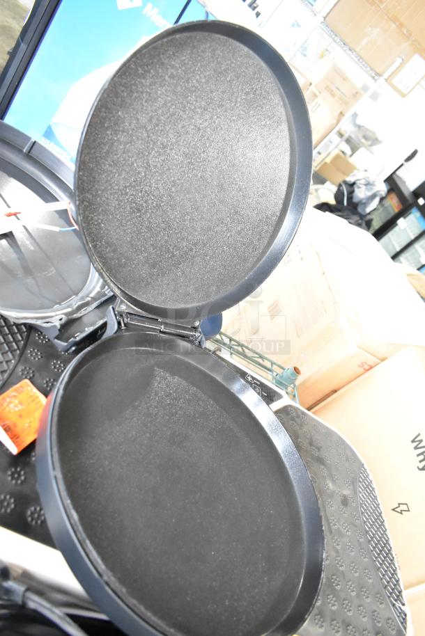 Chefman RJ58-EM-MIDNIGHT-AM-E Pizza Maker, open view. Textured non-stick plates, modern design. Excellent condition.
